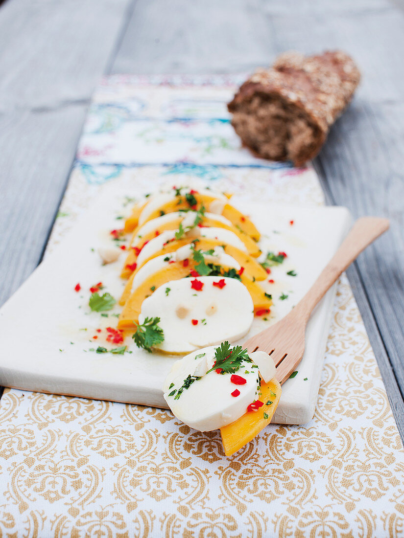 Oriental mango salad with mozzarella, chilli and coriander