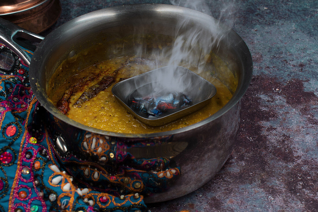 Tarka dhal – yellow lentil curry being made (India)