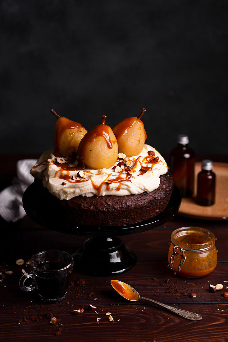 Chocolate cake with pears, whipped cream and caramel