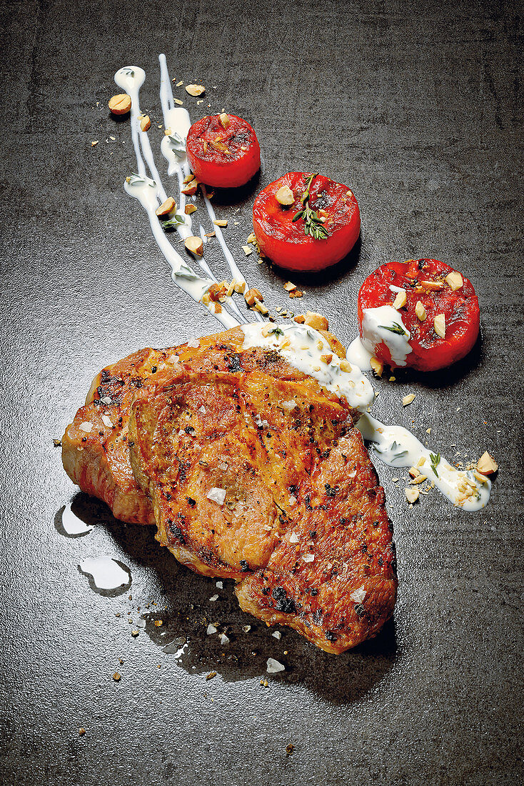 Pork collar steaks with grilled watermelon and goat's cream cheese