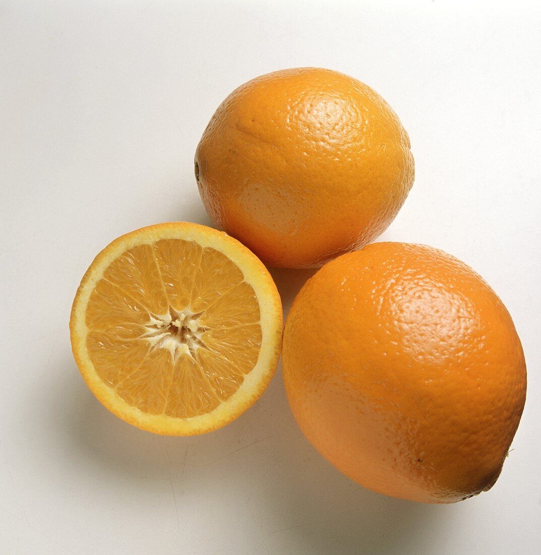 Two Oranges; One Sliced