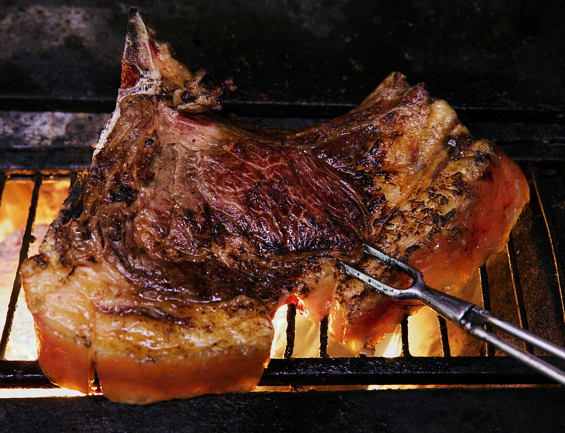 Veal chop on grill