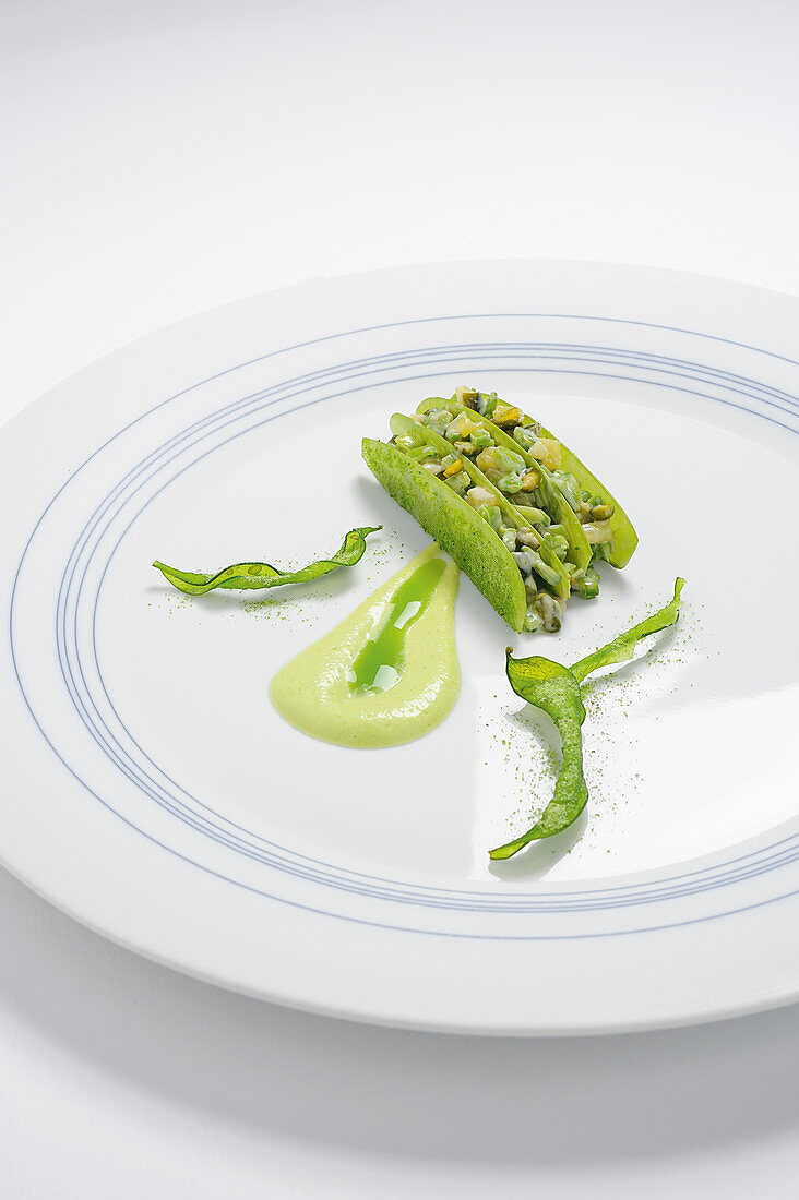 Variations of mange tout with mayonnaise, juice and oil