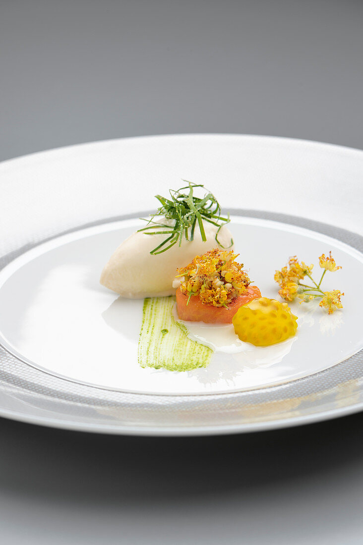Lime flowers with apricot rice, popped rice and tomato seeds