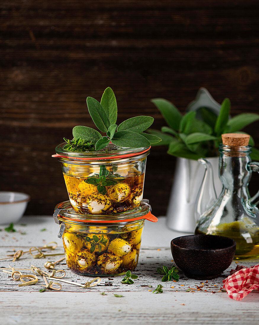 Marinated mozzarella balls in glass jars