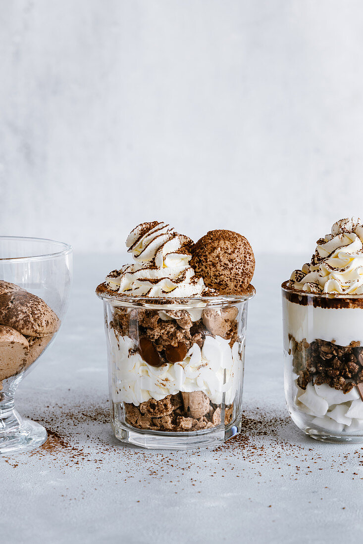 Chocolate and vanilla desserts in glass jars