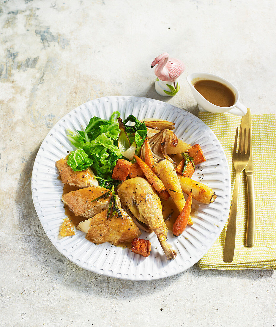 Roast chicken with garlic and rosemary root vegetable