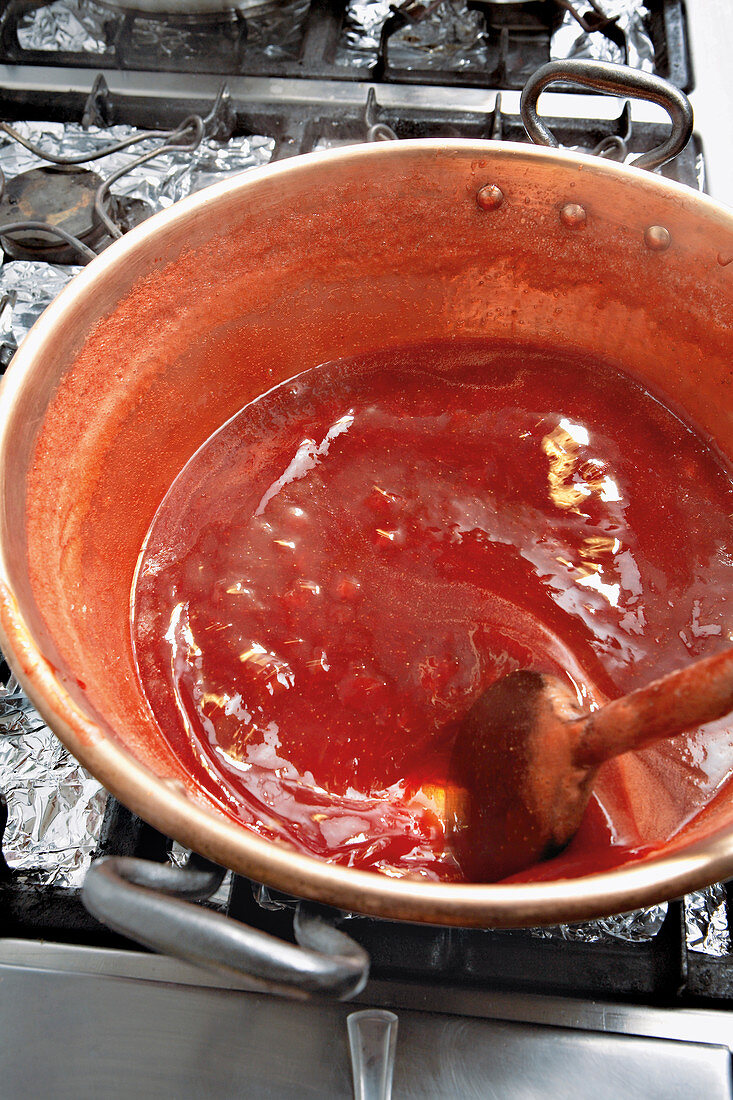 Boiling jam - preparing strawberry jam