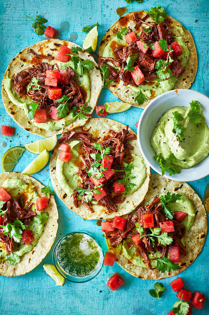 Barbacoa beef tacos with pickled watermelon and avocado sauce