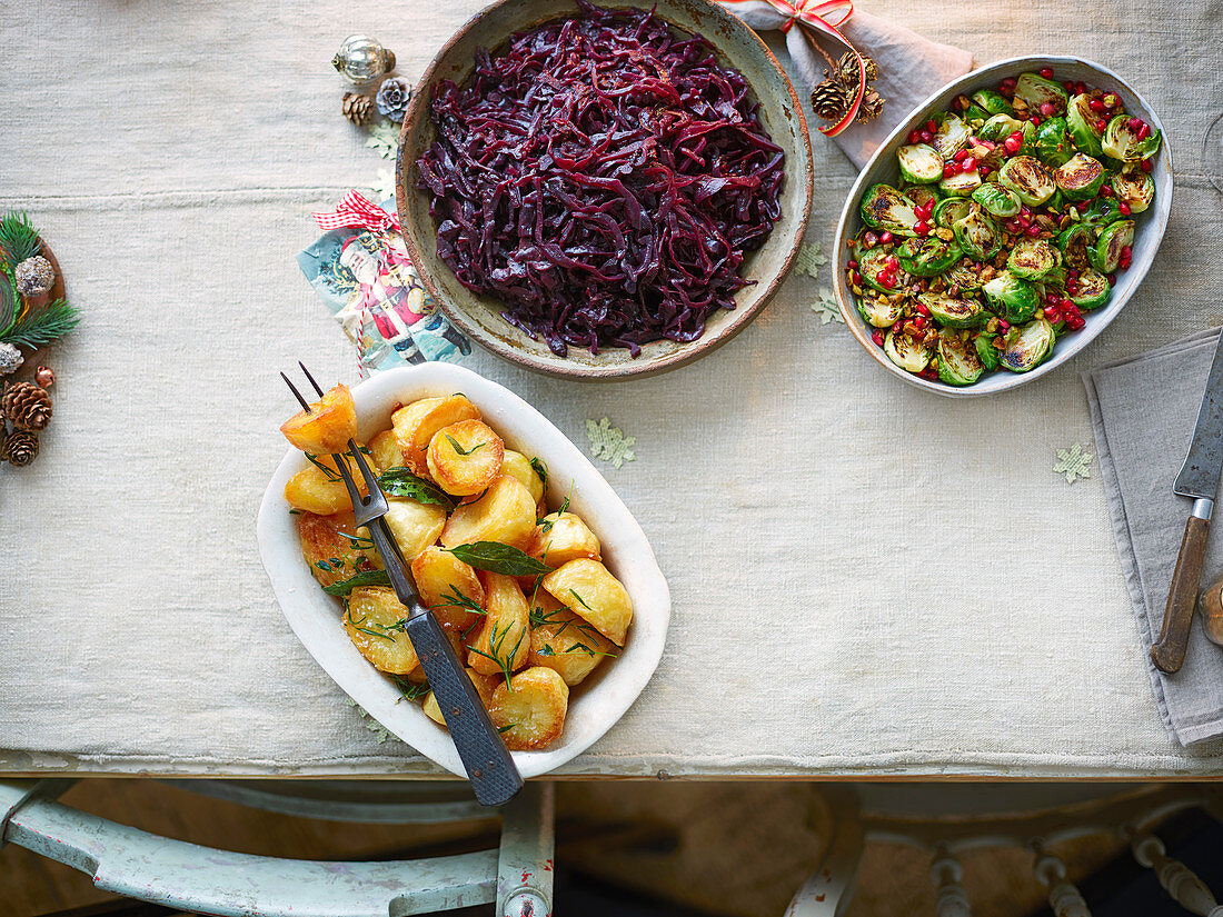 Herb-infused Roast Potatoes, Red Cabbage with port, prunes and orange, Sizzled Sprouts with Pistachios and Pomegranate