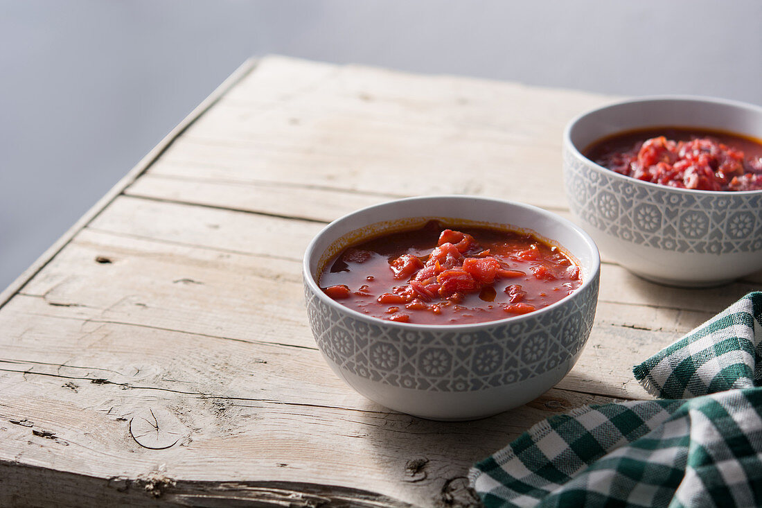 Traditional Ukrainian Russian borsch Beetroot soup on rustic wooden table