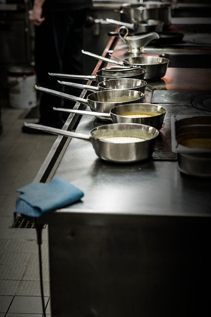 Sauce pots in a restaurant kitchen