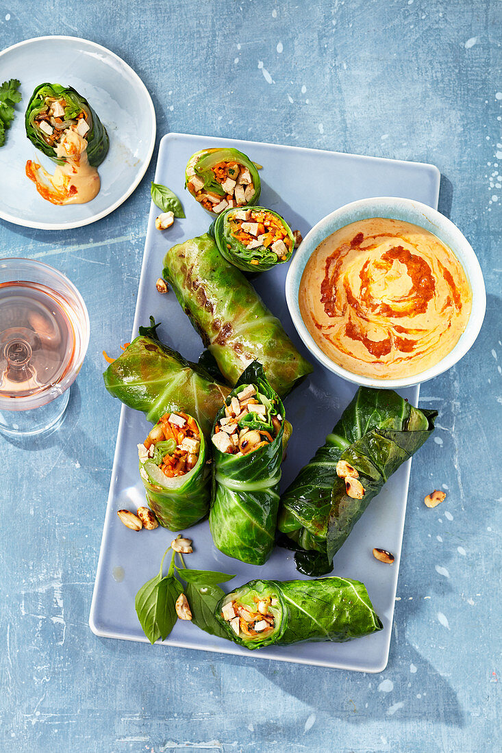 Stuffed cabbage rolls with a coconut and peanut dip