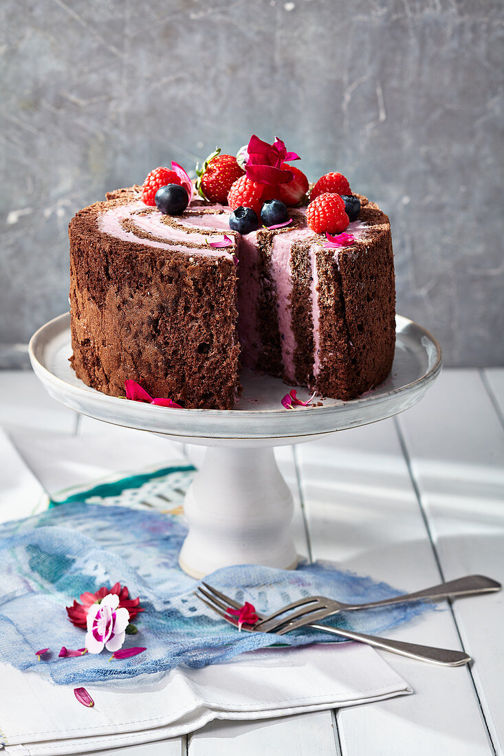 A layered cake with berry and mascarpone cream