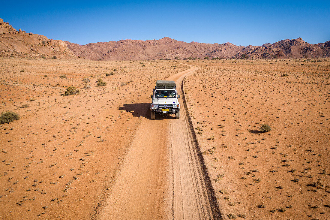 Vehicle crossing desert, Namibia