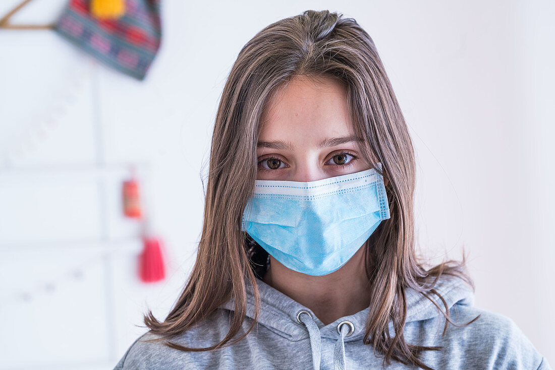 Teenage girl wearing face mask