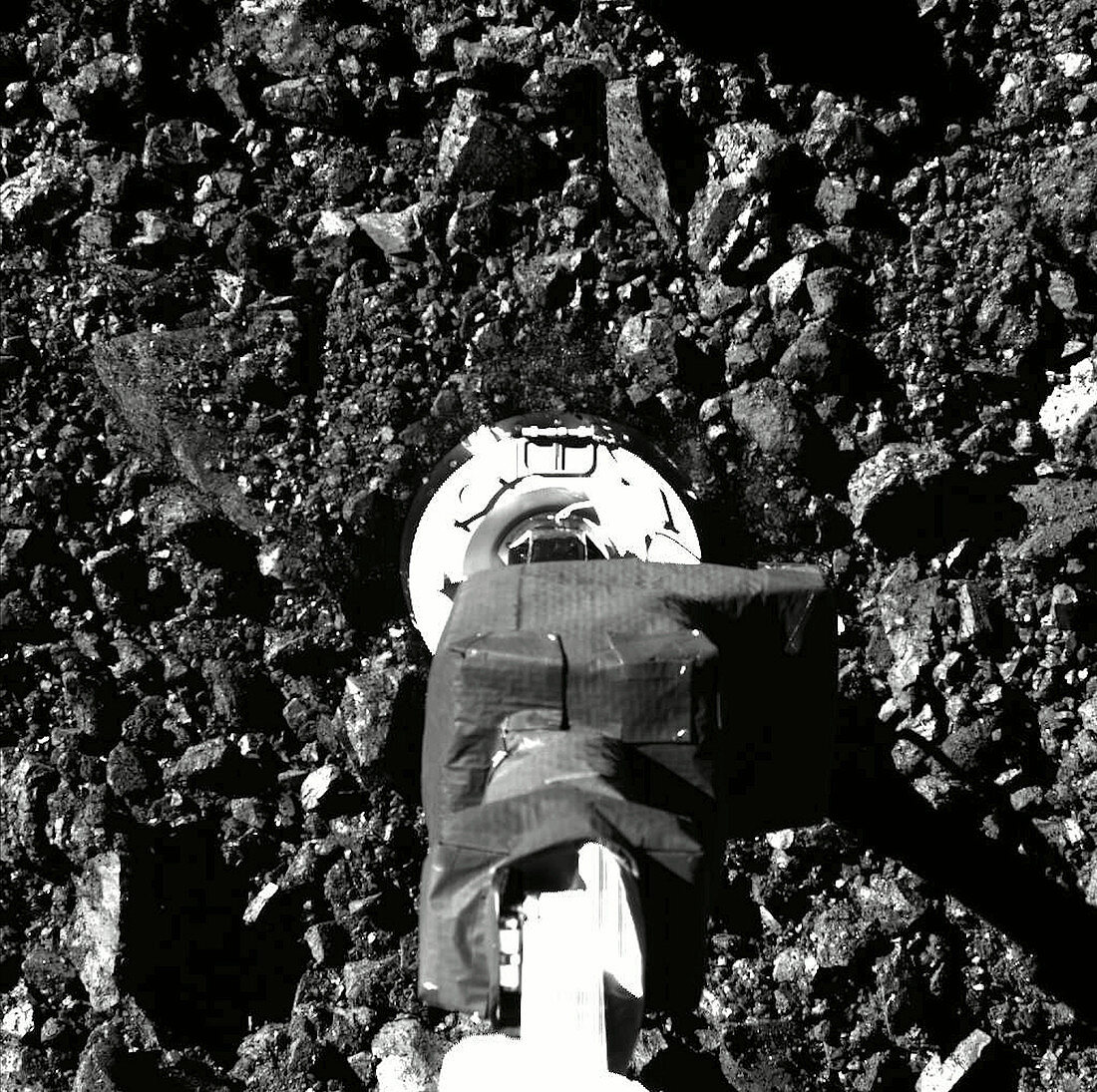 OSIRIS-REx collecting asteroid sample