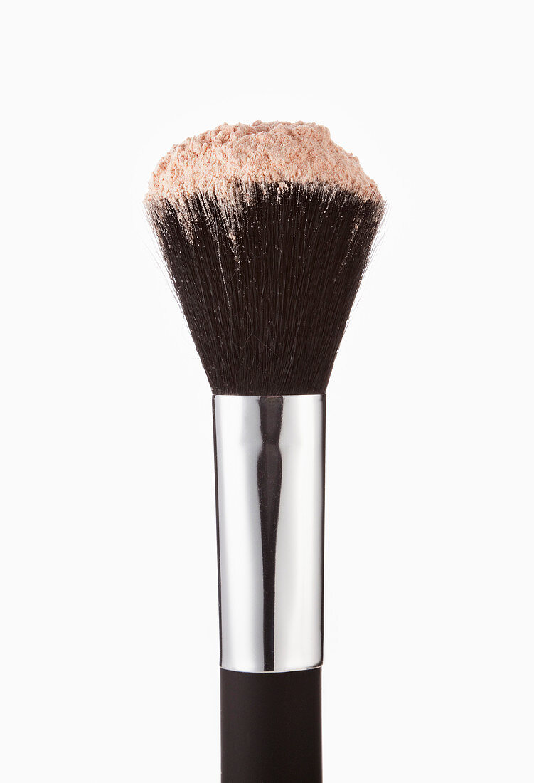 Close up of blush powder on makeup brush
