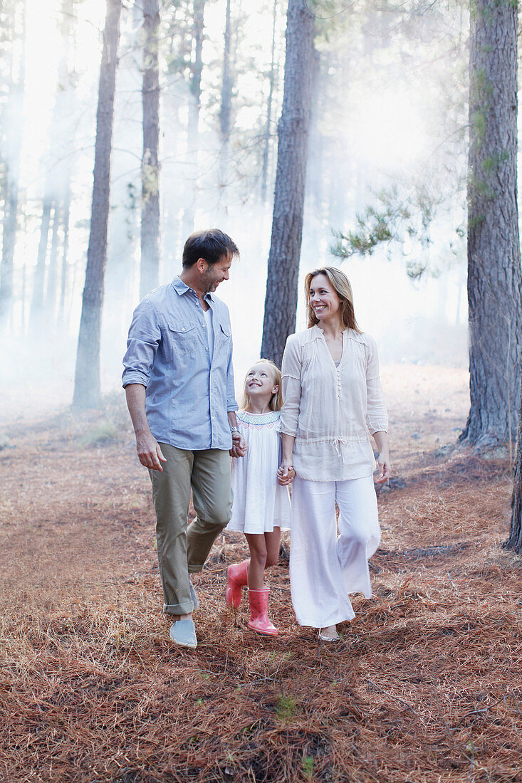 Happy family holding hands