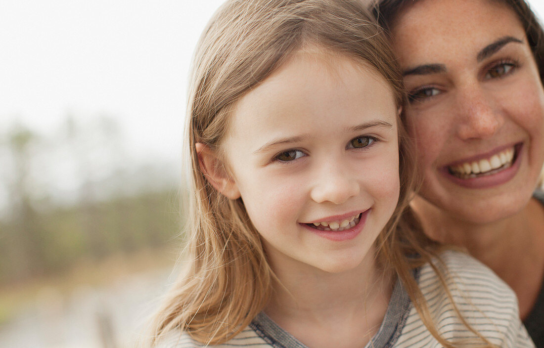 Smiling mother and daughter