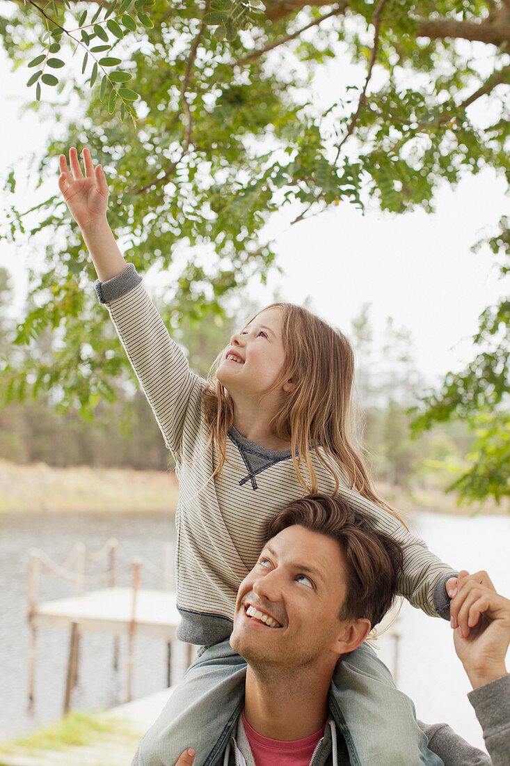 Daughter on father's shoulders