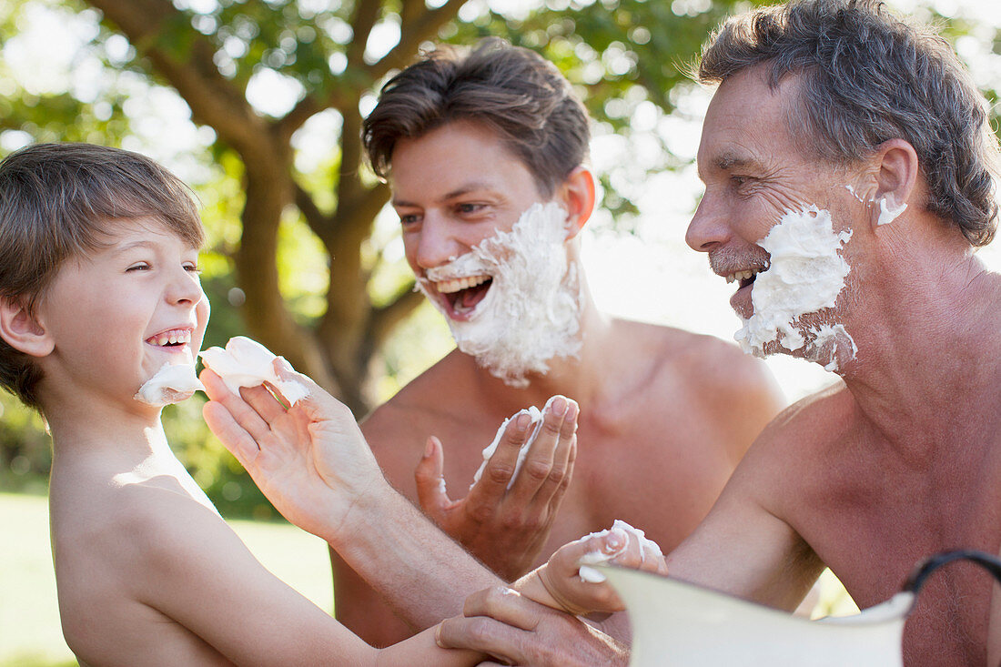 Men applying shaving cream