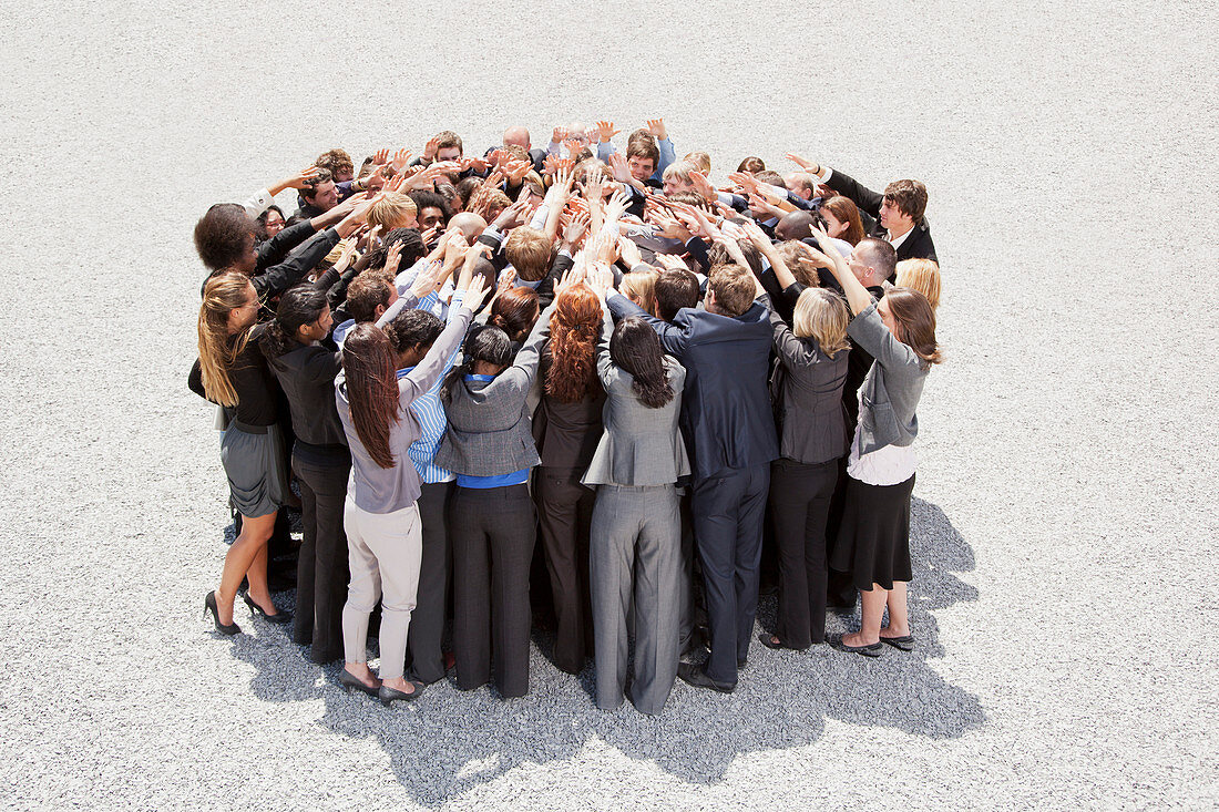 Crowd of business people in huddle