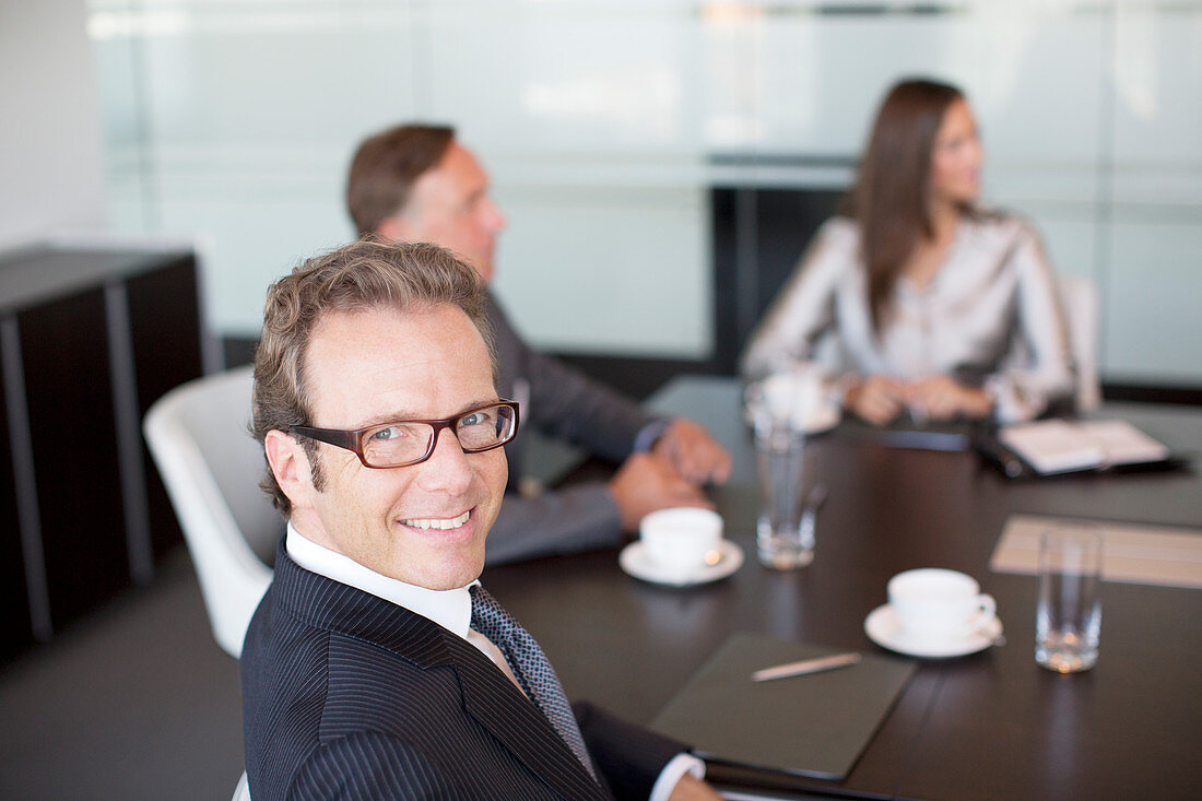 Businessman smiling in meeting