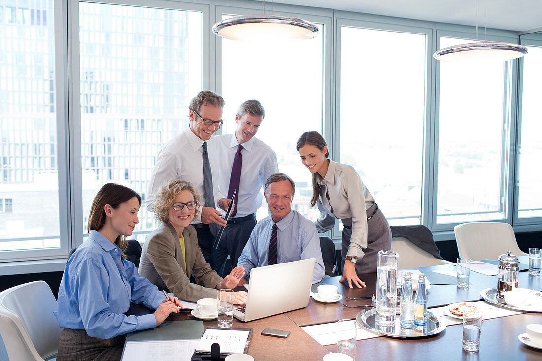 Business people smiling in meeting