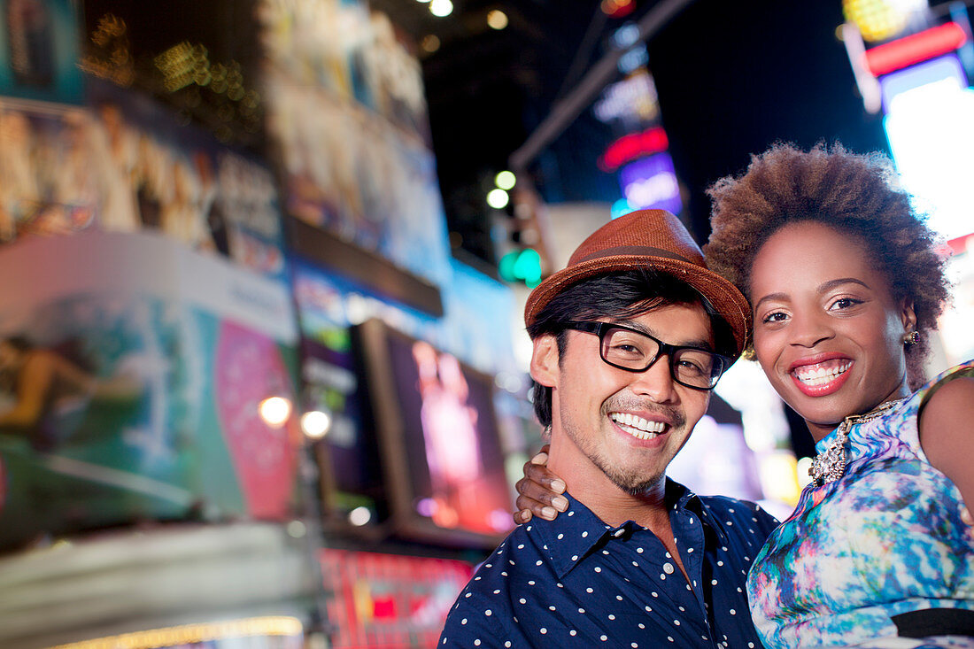 Couple smiling together on city street