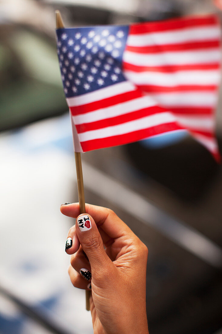 Woman waving American flag
