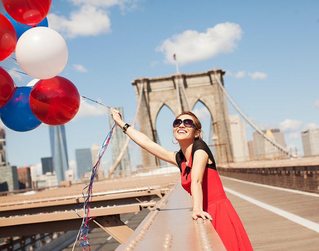 Woman with bunch of balloons