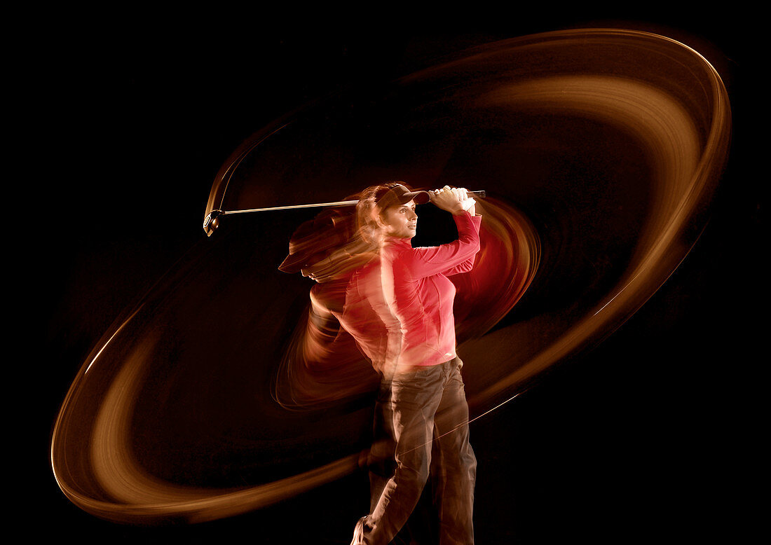 Time lapse view of golfer swinging