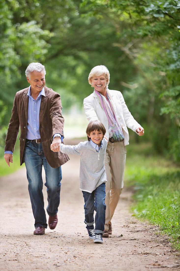 Couple walking with grandson