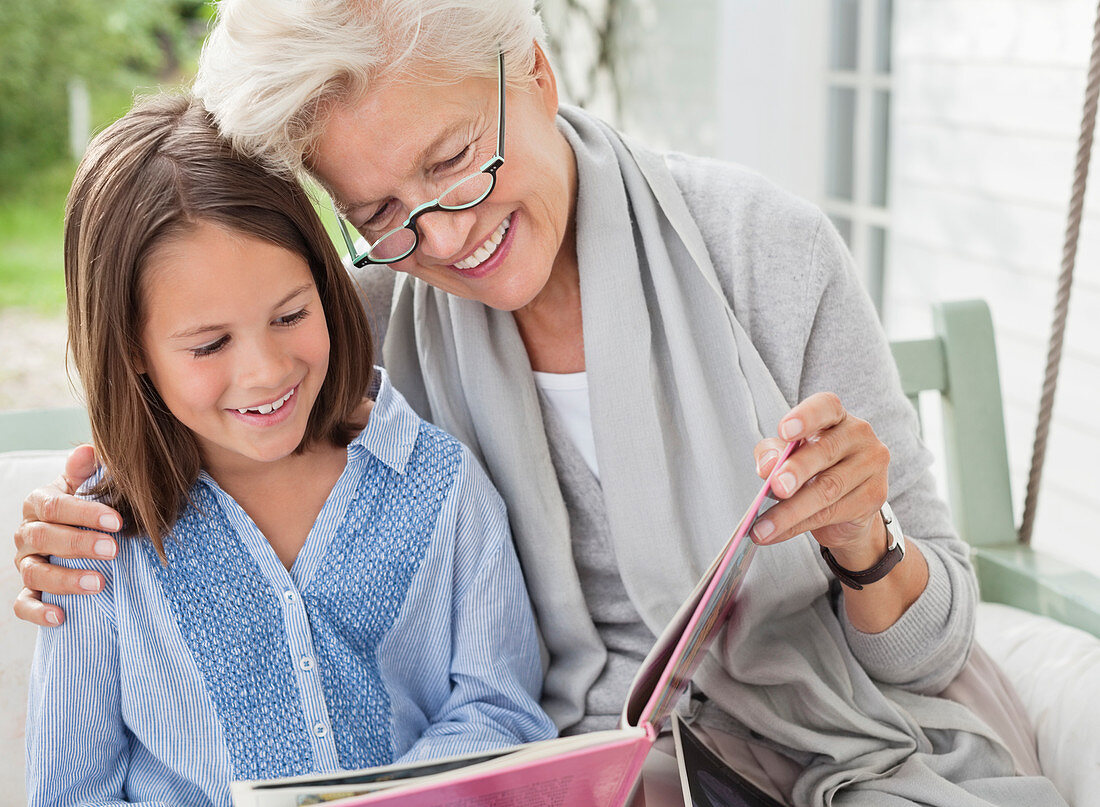 Woman and granddaughter reading