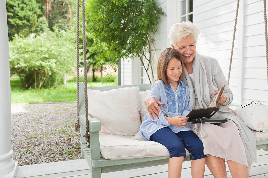 Woman and granddaughter reading