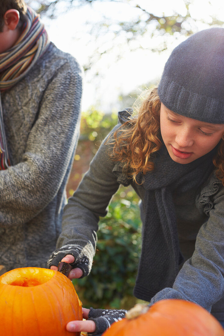 Children carving pumpkins