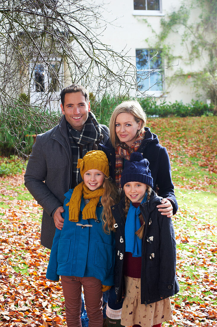 Family smiling together outdoors