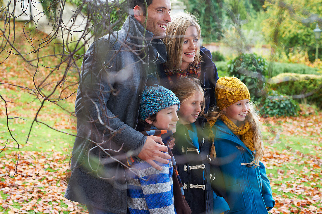 Family smiling together outdoors