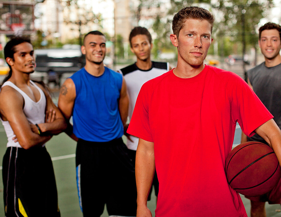 Men standing on basketball court