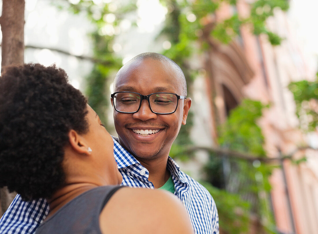 Couple walking together on city street