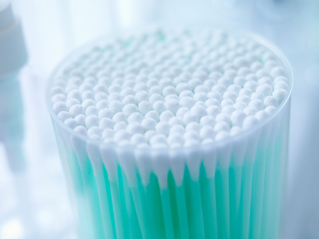 Close up of cup of cotton buds