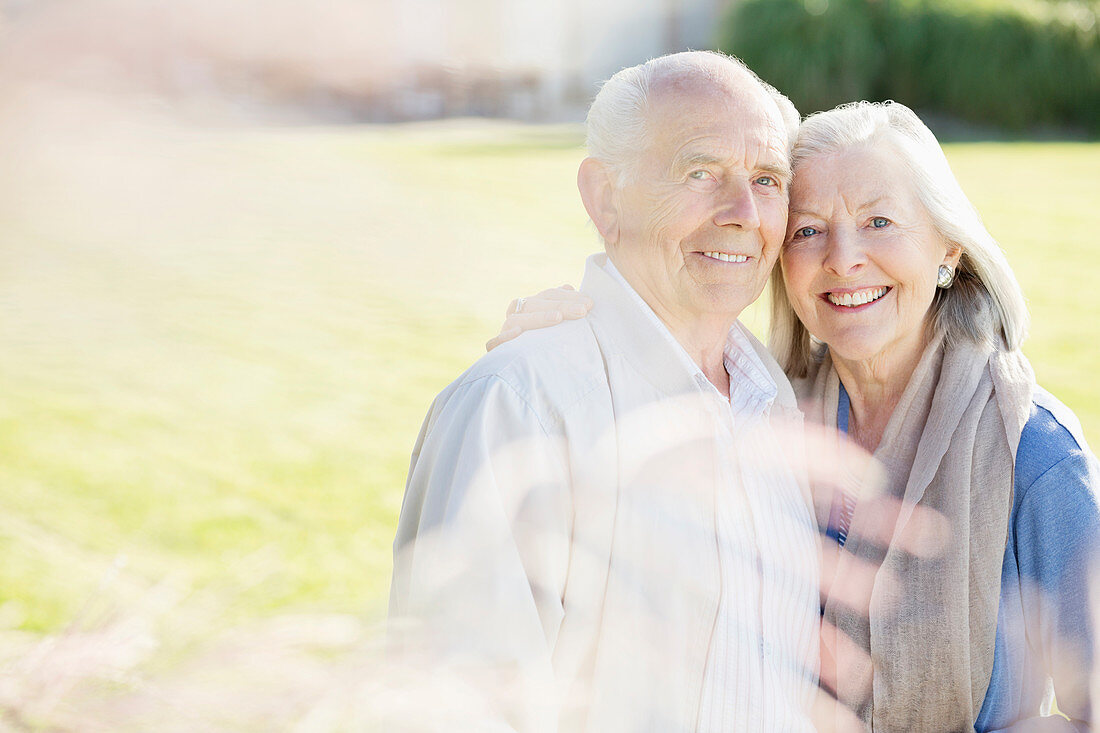 Older couple smiling outdoors