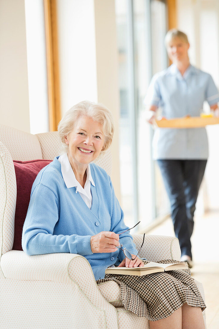 Older woman smiling in armchair