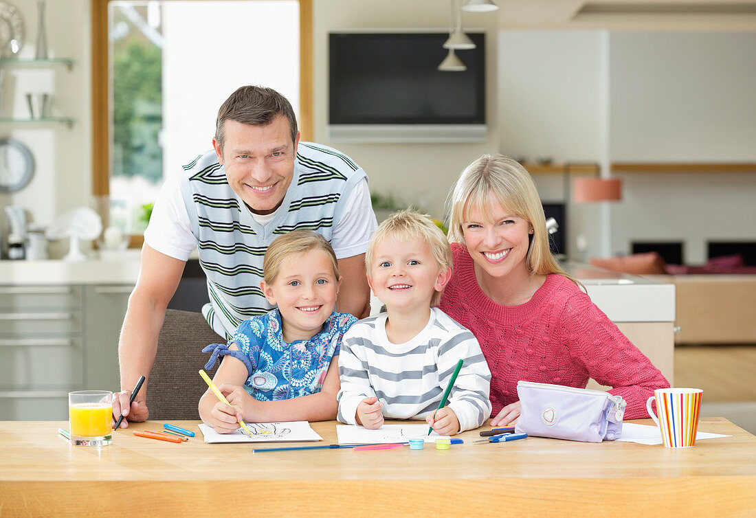 Family smiling together at table