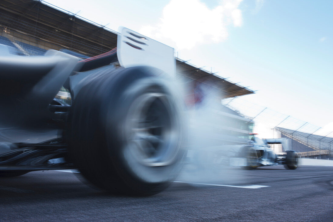 Race cars driving on track