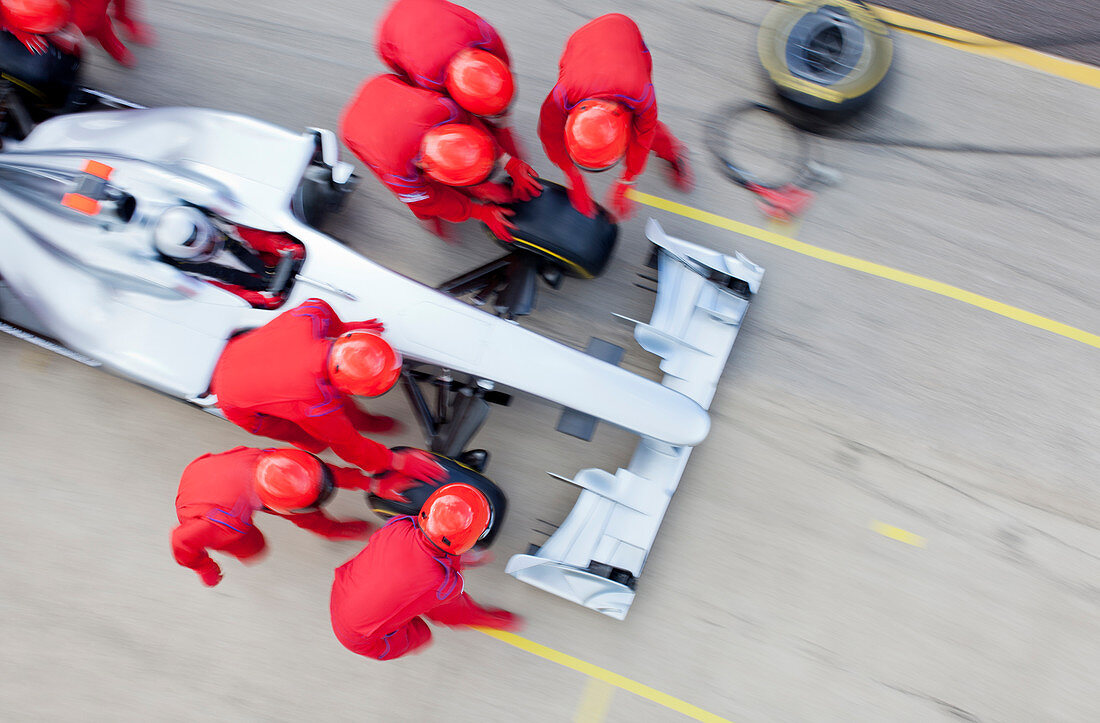 Racing team working at pit stop