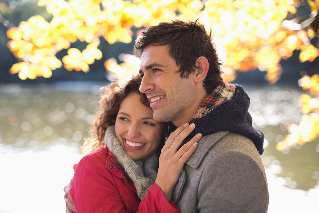 Couple smiling together in park