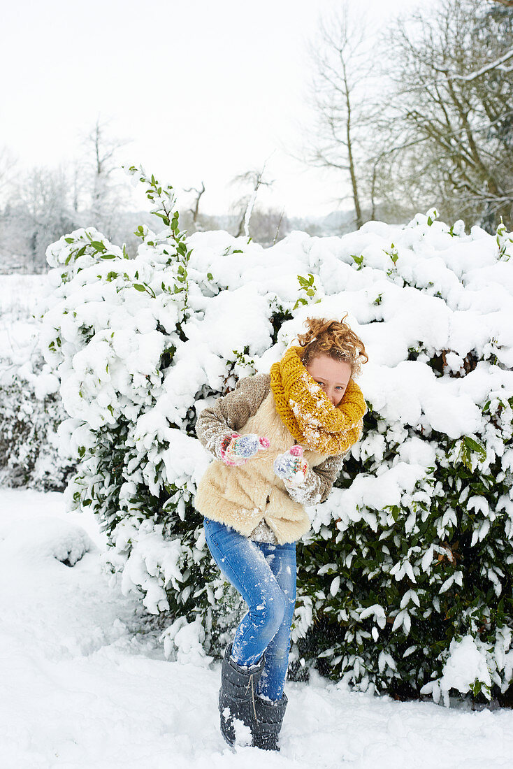 Girl playing in snow