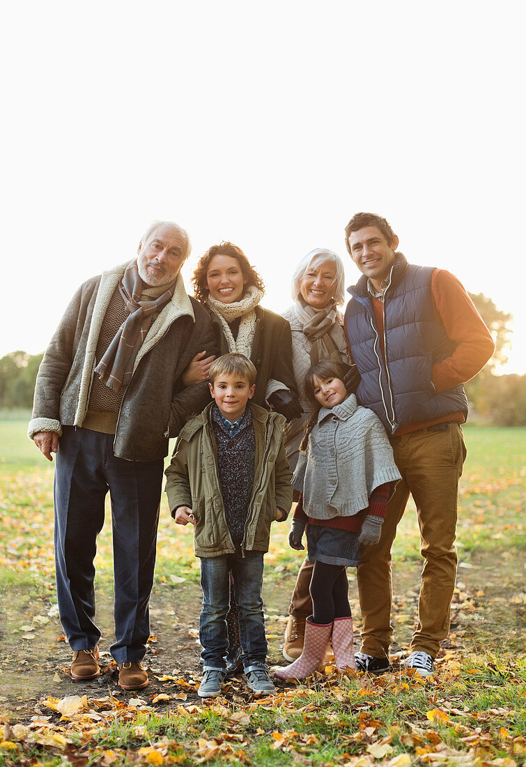 Family smiling together in park